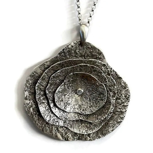 Sterling silver multi layered freeform pendant  necklace on a 17 to 19 inch chain