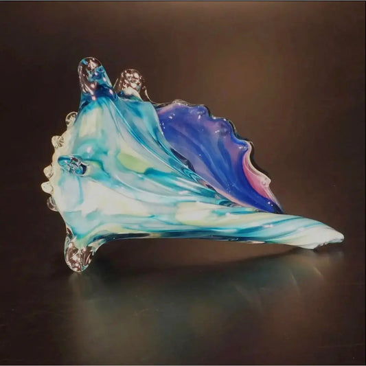 Seashell Shown in Blue Topaz And Purple by The Glass Forge