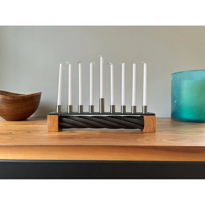 Menorah made with recycled ski lift cable, steel, and cherry wood.