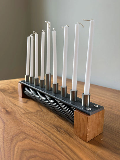 Menorah made with recycled ski lift cable, steel, and cherry wood.