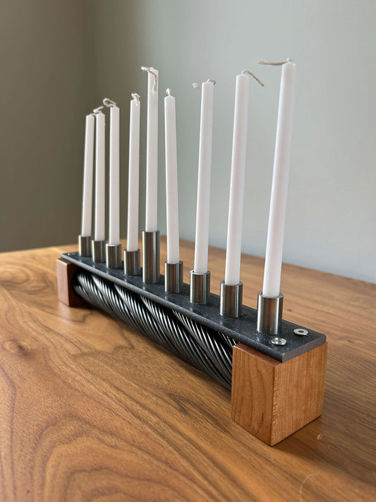Menorah made with recycled ski lift cable, steel, and cherry wood.