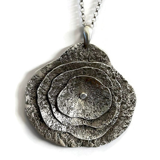 Sterling silver multi layered freeform pendant  necklace on a 17 to 19 inch chain