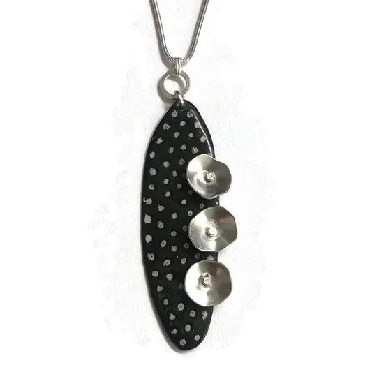 
Enamel and sterling silver pendant available in four colors