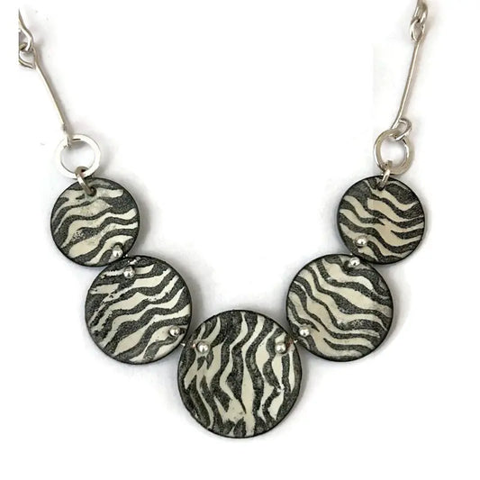 Necklace with zebra print pendant available in four colors